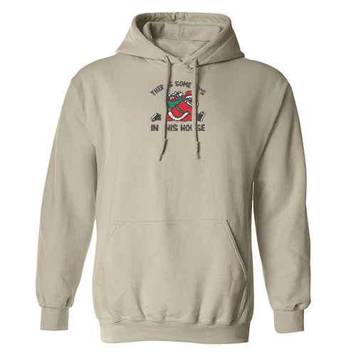 hoodie beige avec pere noel faisant une split le grand écart avec sac de jouet