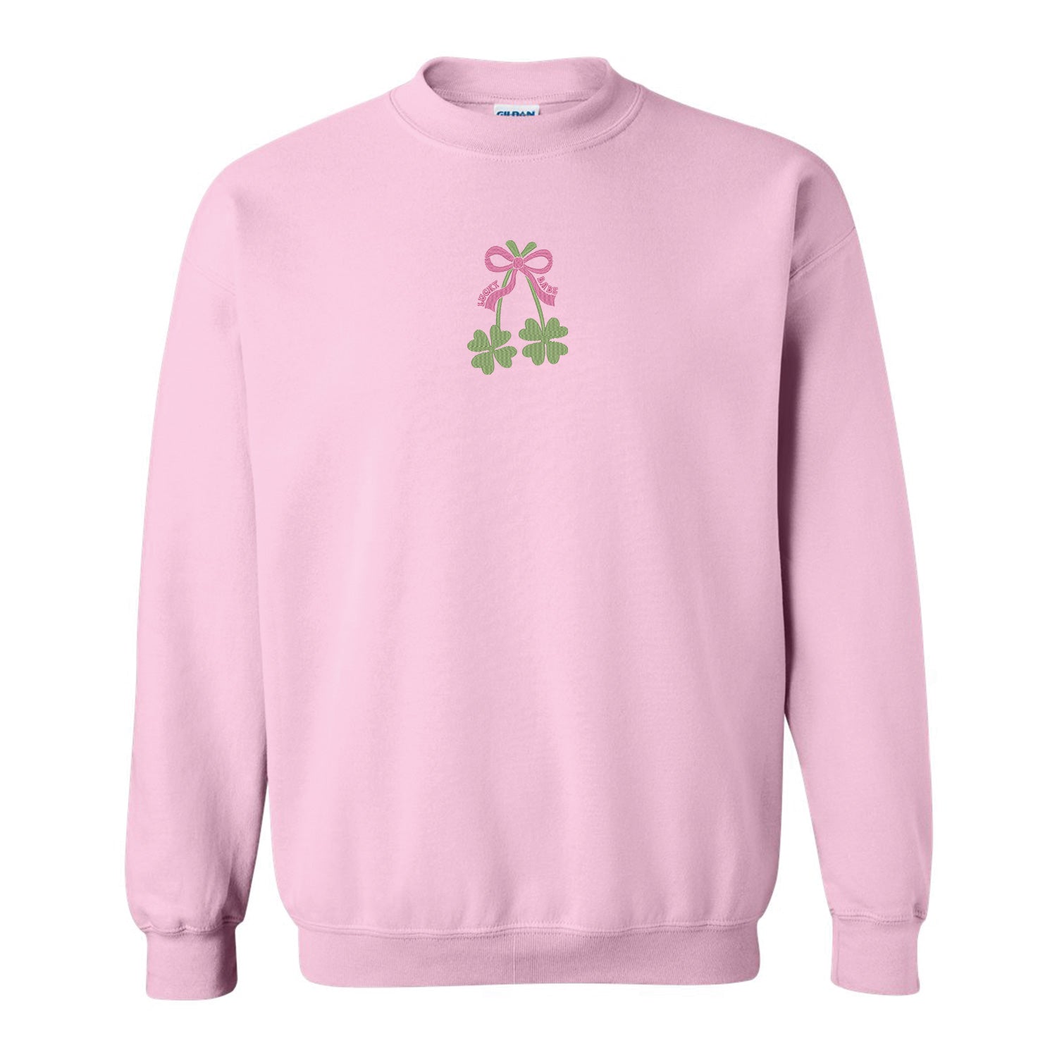 coton ouaté à col rond rose pâle avec broderie de deux trèfles à quatre feuilles vertes ainsi qu'une boucle rose