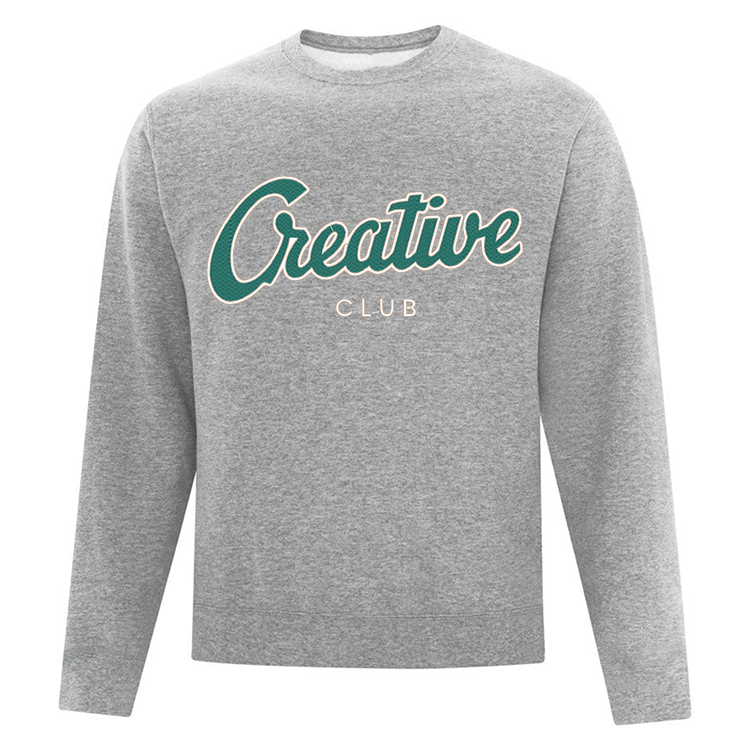 crewneck gris pâle ayant une grosse broderie verte et blanche creative club