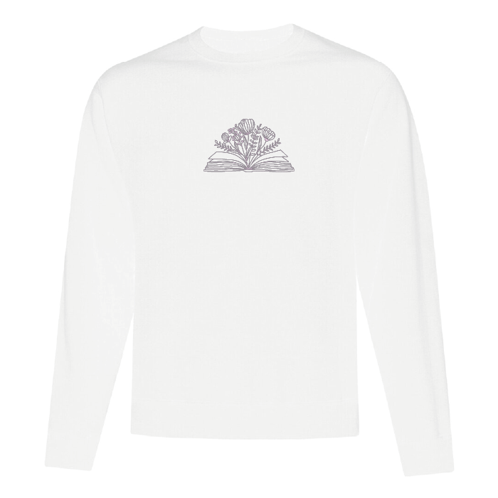 crewneck blanc brodé avec un livre et des fleurs minimalistes