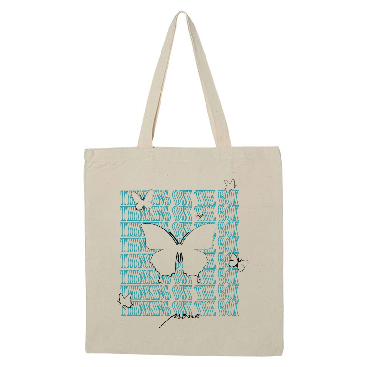 tote bag thinking out the box imprimé en noir et bleu turquoise avec des papillons