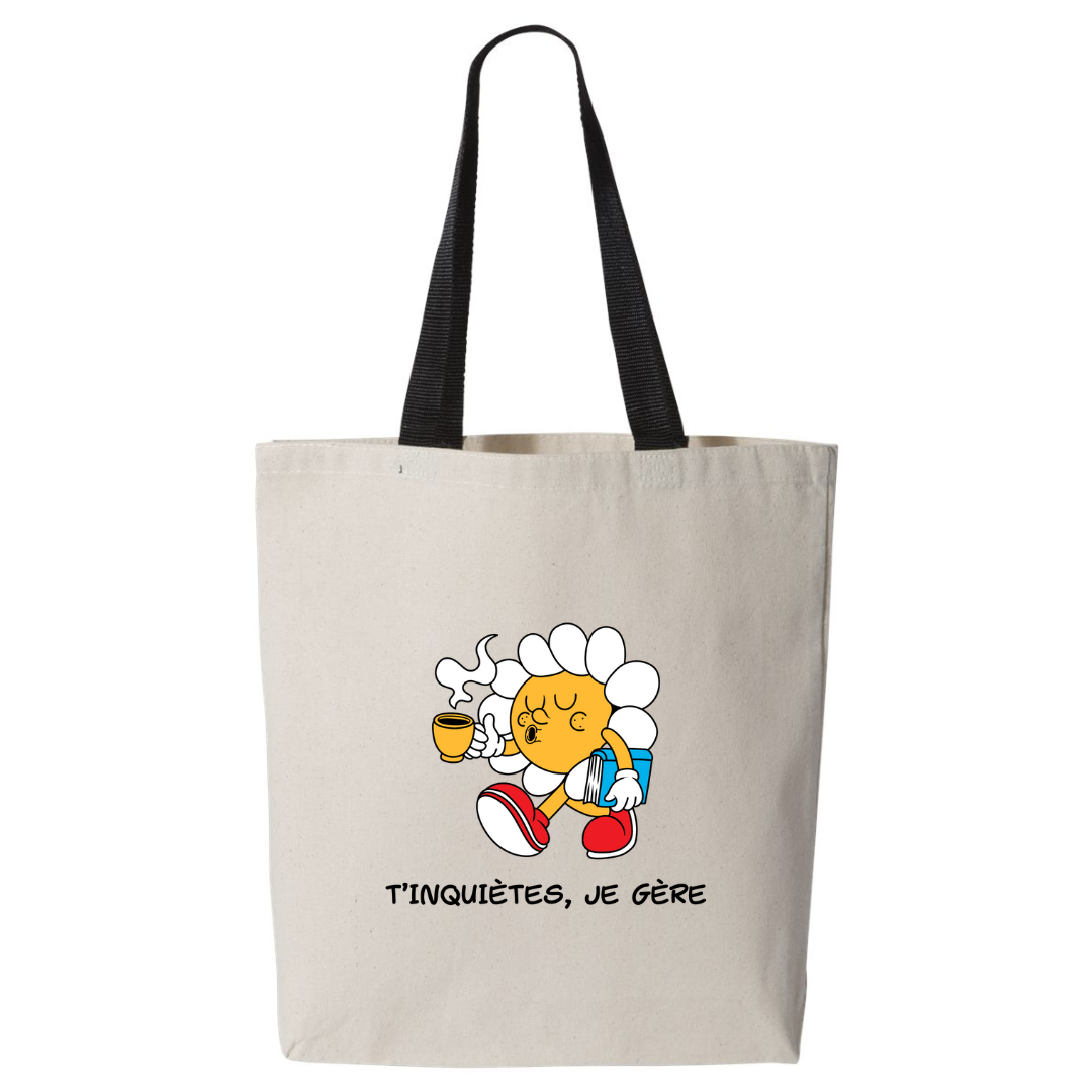 sac fourre-tout beige à poignées noires avec imprimé fleur animée et café avec l'inscription t'inquiètes je gère